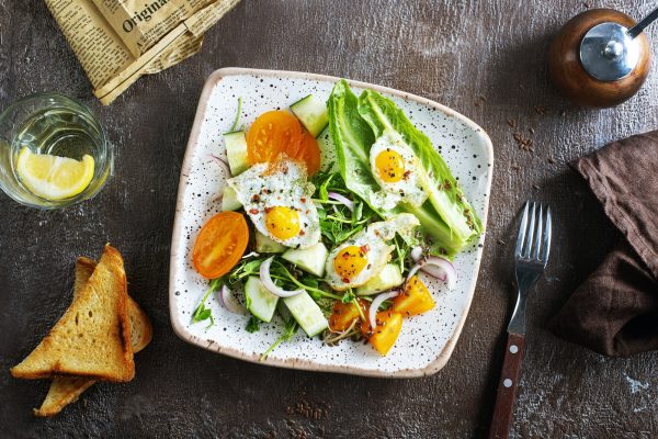 fried-eggs-with-vegetables-top-view-diet-salad-with-quail-eggs.jpg